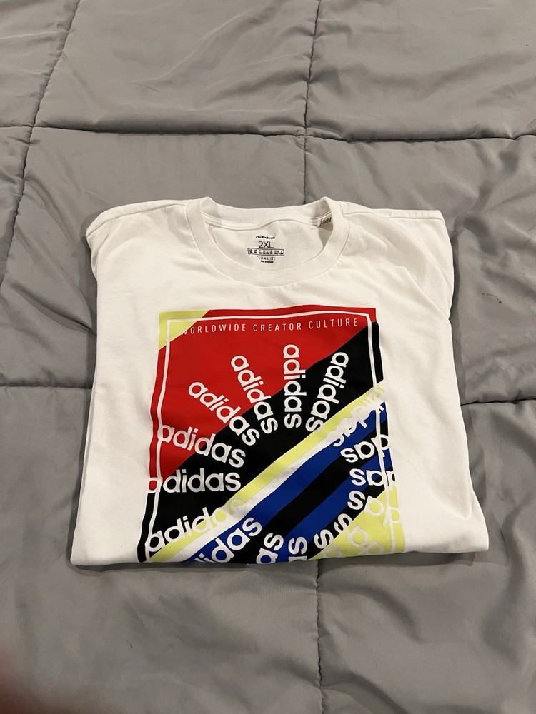 adidas Men’s 2XL White Graphic Tee with Red, Black, Blue & Yellow Print